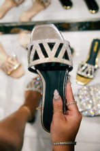 Load image into Gallery viewer, Silver-Tone Sandals being Held My Women Model