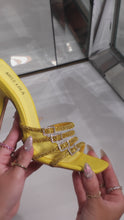 Load and play video in Gallery viewer, model holding yellow embellished mule