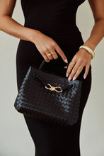 Load image into Gallery viewer, Black Woven Bag Styled with Black Dress
