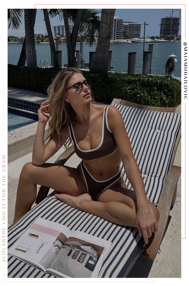 Load image into Gallery viewer, Girl Sitting Poolside Wearing Brown Bikini with White Contrast

