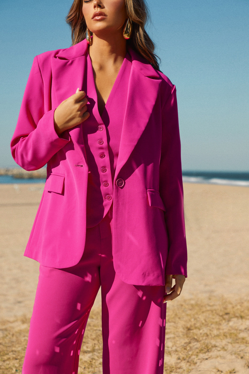 Model Wearing Holiday Outfit with Oversized Earrings