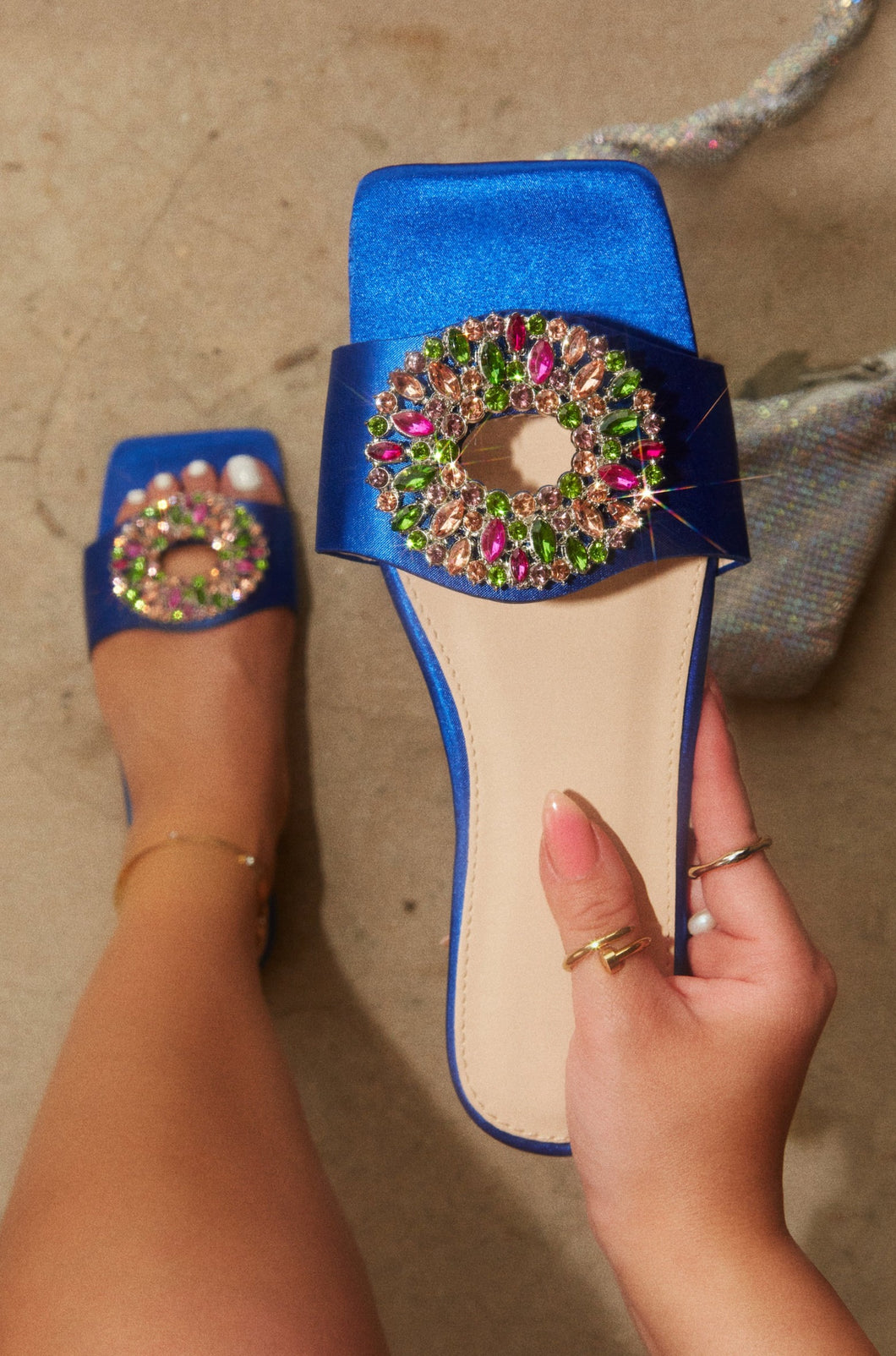 Women Holding Blue Embellished Sandals