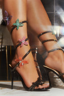 Women Wearing Black Embellished Butterfly Heels