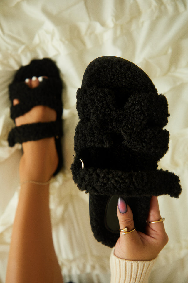 Load image into Gallery viewer, Black Faux Sherpa Sandal Held By Female Model
