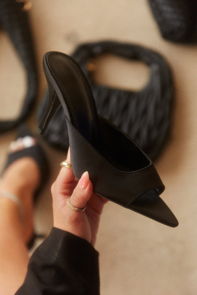 Load image into Gallery viewer, Women Holding Black Slip On Heels

