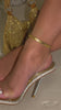Gold embellished detailing with clear straps heels on model