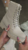 model wearing bone embellished boots video