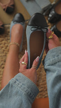 Load and play video in Gallery viewer, Video of denim bow flats with black toe
