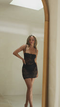 Load and play video in Gallery viewer, Model wearing black mini lace dress video
