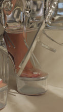 Load and play video in Gallery viewer, Model wearing silver clear platform chunky heel video
