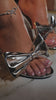 Video of silver bow detailed heels