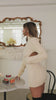 Cream sweater dress on model video