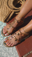 Load and play video in Gallery viewer, Model wearing gold tone embellished sandal video
