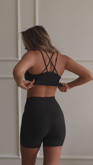 black rib knit workout top on model