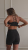 black rib knit workout top on model