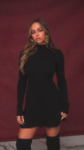 Load and play video in Gallery viewer, Video of model wearing black long sleeve knit dress
