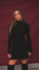 Video of model wearing black long sleeve knit dress