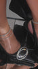 Video of model wearing black embellished high heel pump