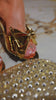 Video of gold bow detailed heels