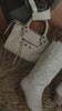 Video of white cowgirl boots on model