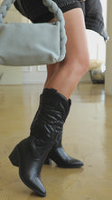 Load and play video in Gallery viewer, Video of black cowgirl boots on model
