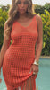 orange crochet dress with fringe hem on model