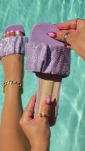 Load and play video in Gallery viewer, Video of Lilac embellished slip on sandals by the pool
