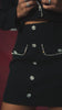 Video of black embellished set on model