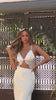 Model wearing cream satin two piece set video