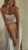 model wearing white corset dress video