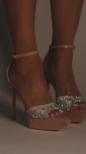 Model wearing nude embellished platform heels video