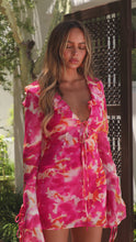 Load and play video in Gallery viewer, Model wearing pink floral mini dress
