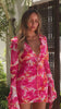 Model wearing pink floral mini dress