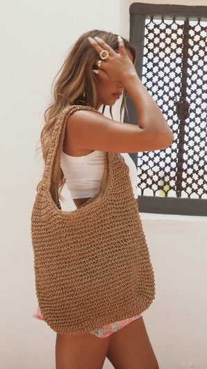 Model wearing woven shoulder bag video