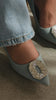 Video of denim embellished pump on model