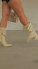 Model strutting in boots