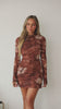 Video of model wearing brown mini dress
