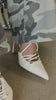 Model wearing white lace up heels video