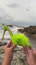 Load and play video in Gallery viewer, Model holding green feather embellished pump mule by the ocean video
