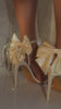 Video of cream bow detailed heels