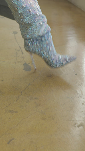 Model wearing embellished denim boots video