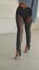 Model wearing mesh black denim jeans