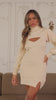 Video of model wearing cream knit long sleeve mini dress 