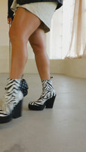 Load and play video in Gallery viewer, Model walking in abstract zebra printed boots

