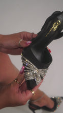 Load and play video in Gallery viewer, Video of black high heel pump on model

