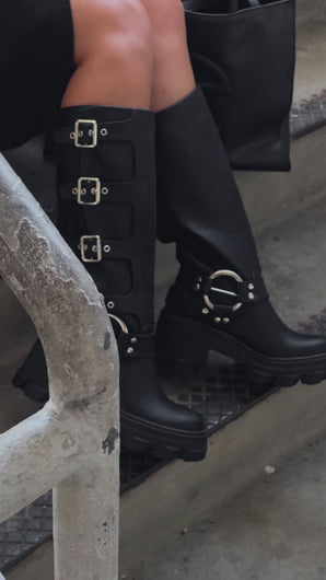 Model wearing black platform boots video