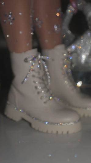 Video of model wearing embellished boots