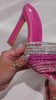 Model wearing pink embellished high heel mules video