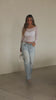 Model wearing white mesh long sleeve top video