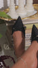 Video of black denim mules 